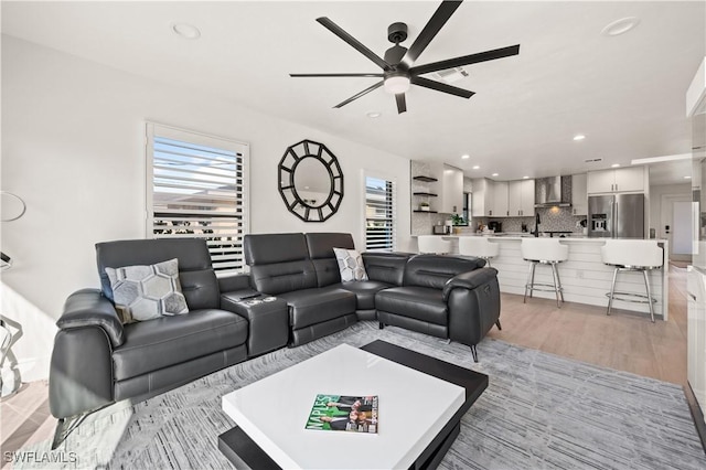 538 106th Ave N, Naples, FL 34108 - living area featuring a ceiling fan, light wood-style floors, and recessed lighting