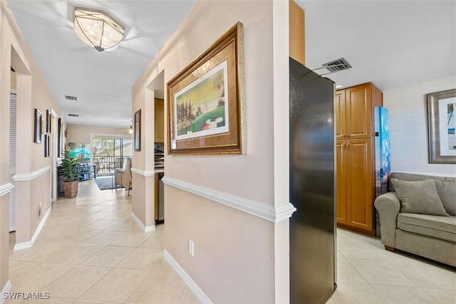 hallway featuring light tile patterned floors