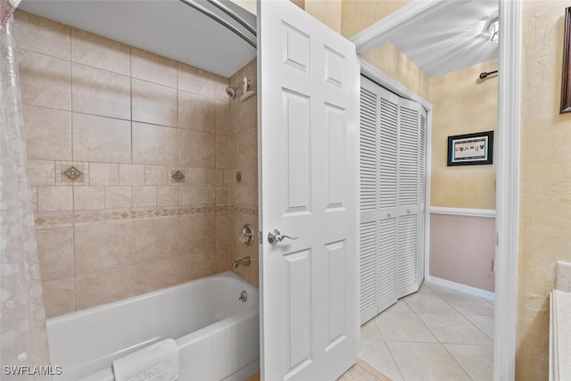 bathroom with tile patterned floors and shower / bath combination with curtain