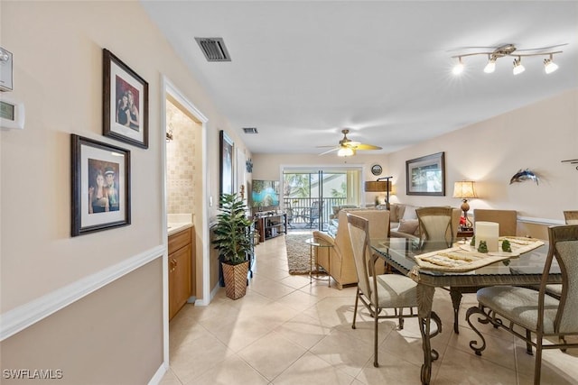 dining room with ceiling fan and light tile patterned floors