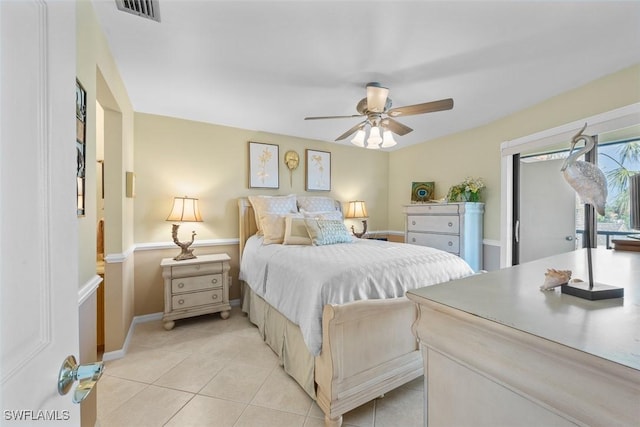 tiled bedroom featuring ceiling fan and access to exterior