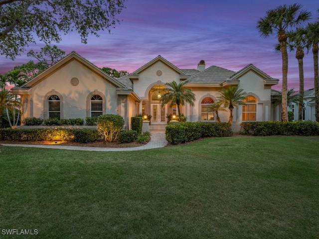 view of front of home featuring a yard