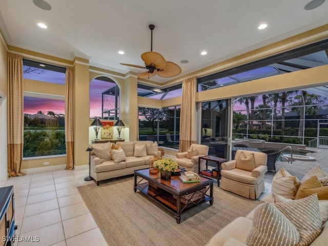 tiled living room featuring ornamental molding and ceiling fan