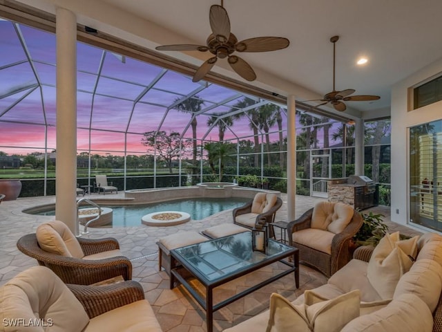 pool at dusk with outdoor lounge area, area for grilling, a grill, a lanai, and a patio area