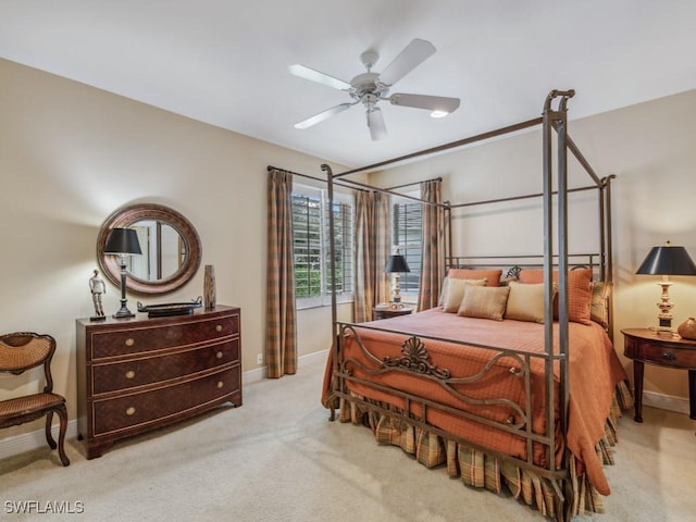 bedroom featuring light carpet and ceiling fan