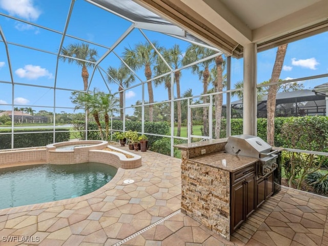 view of patio / terrace featuring an in ground hot tub, an outdoor kitchen, a lanai, and area for grilling