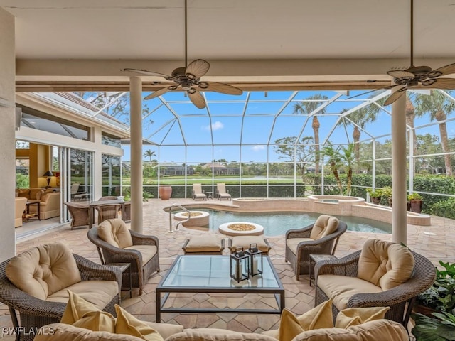 sunroom / solarium with a wealth of natural light and ceiling fan
