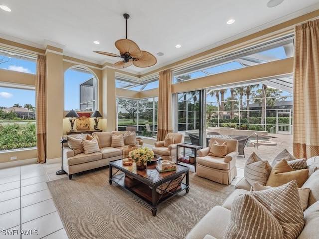 sunroom / solarium with ceiling fan and a healthy amount of sunlight