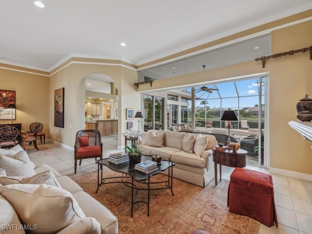 living room featuring crown molding and light tile patterned floors