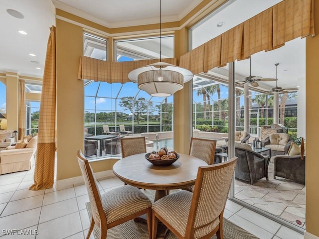sunroom / solarium featuring ceiling fan