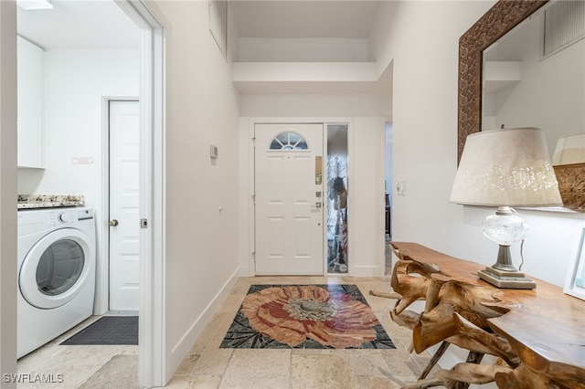 foyer entrance with washer / clothes dryer