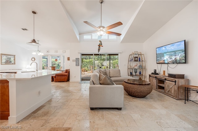 living room with high vaulted ceiling, sink, and ceiling fan