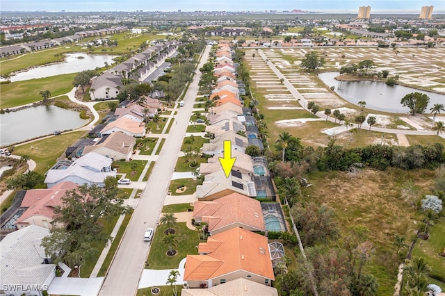 birds eye view of property with a water view