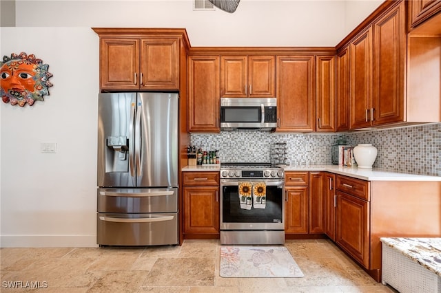 kitchen with decorative backsplash and appliances with stainless steel finishes