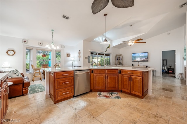 kitchen with decorative light fixtures, a kitchen island with sink, dishwasher, and lofted ceiling