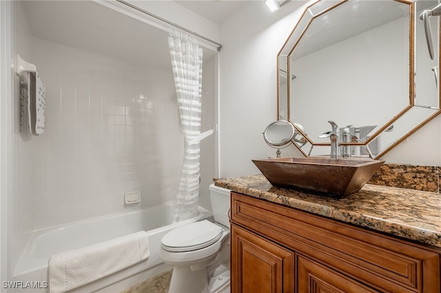 full bathroom featuring toilet, vanity, and shower / tub combo