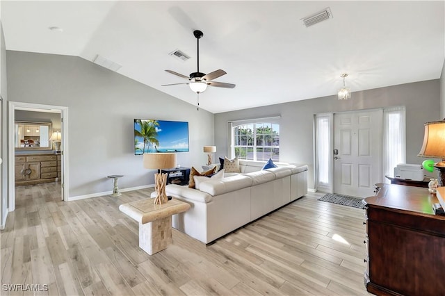 living room featuring light wood-type flooring, vaulted ceiling, and ceiling fan