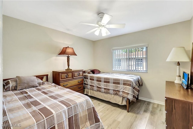 bedroom with light wood-type flooring and ceiling fan