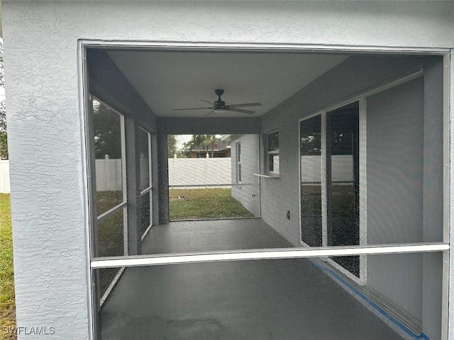 view of patio featuring ceiling fan