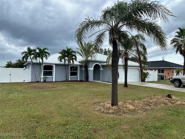 ranch-style house with a garage and a front lawn