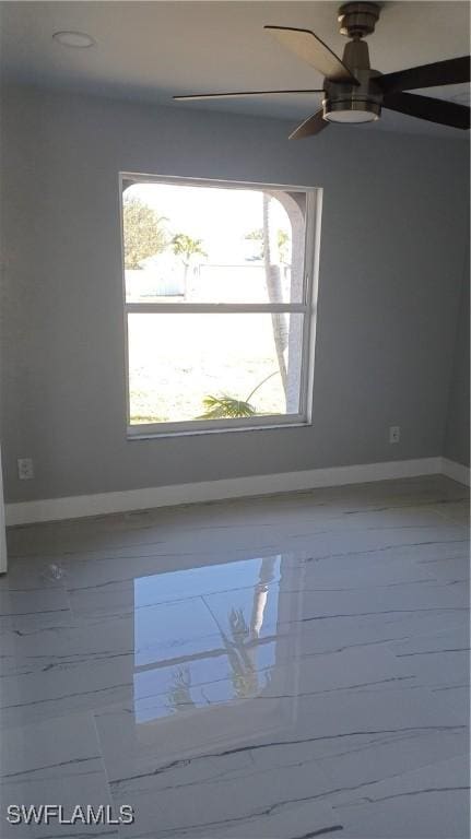 spare room featuring ceiling fan