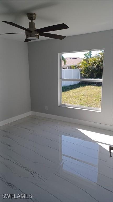 spare room featuring ceiling fan