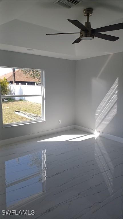 empty room featuring ceiling fan