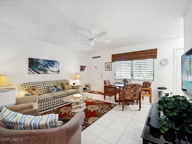 living room with ceiling fan and light tile patterned floors