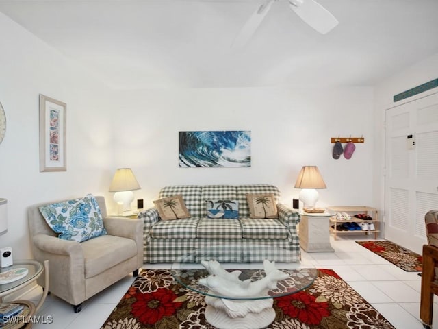 living room featuring ceiling fan and light tile patterned flooring