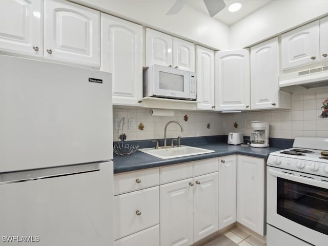 kitchen featuring sink, white cabinetry, ceiling fan, white appliances, and backsplash