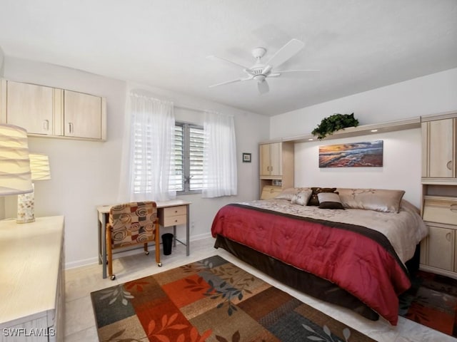 tiled bedroom featuring ceiling fan