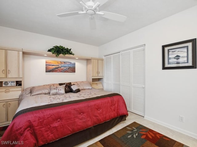 carpeted bedroom with ceiling fan and a closet