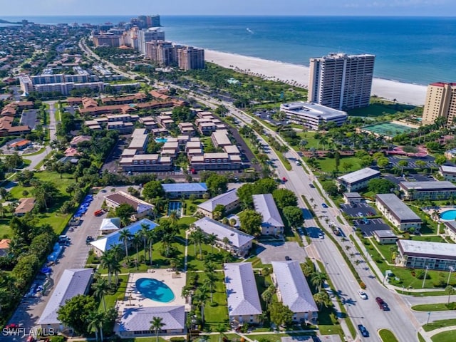 birds eye view of property featuring a view of the beach and a water view