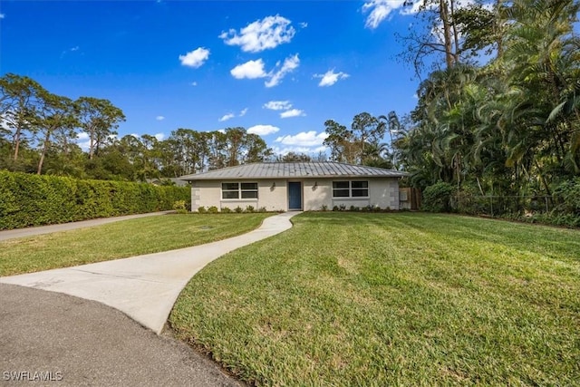 ranch-style home with a front lawn