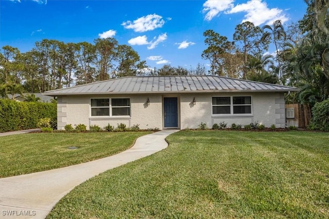 ranch-style home featuring a front yard