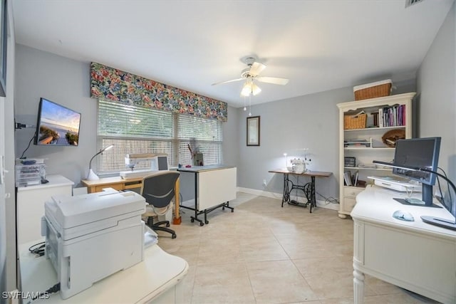 tiled office space featuring ceiling fan