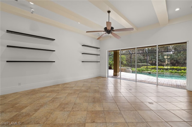 tiled empty room featuring ceiling fan and beam ceiling