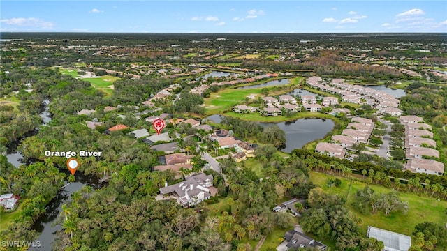 aerial view featuring a residential view, golf course view, and a water view