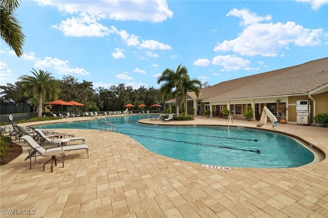 view of swimming pool featuring a patio area