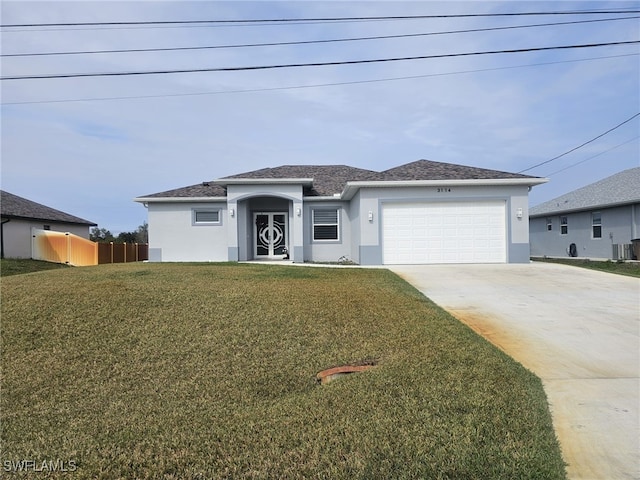 view of front facade featuring a garage and a front yard