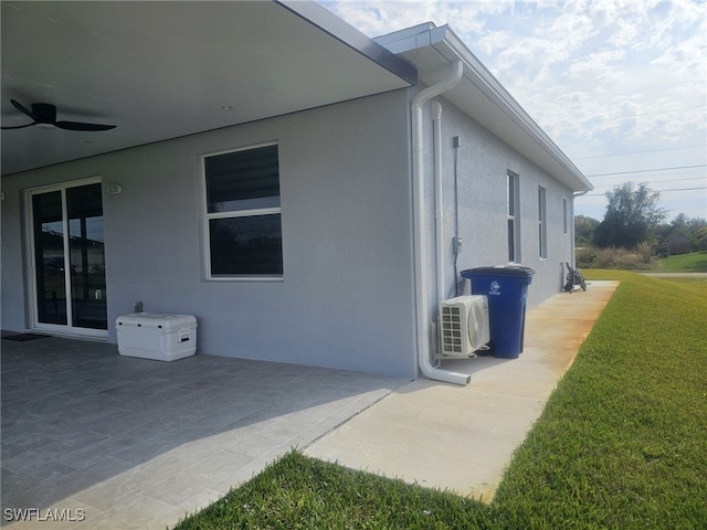 view of property exterior featuring ceiling fan, ac unit, a lawn, and a patio