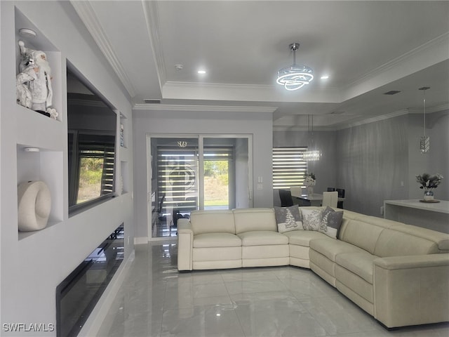 living room with ornamental molding, a raised ceiling, and a notable chandelier