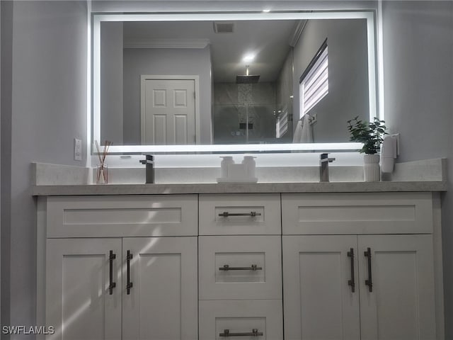 bathroom featuring ornamental molding, walk in shower, and vanity