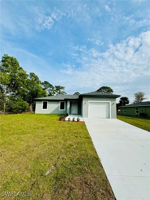 ranch-style home with a front lawn and a garage