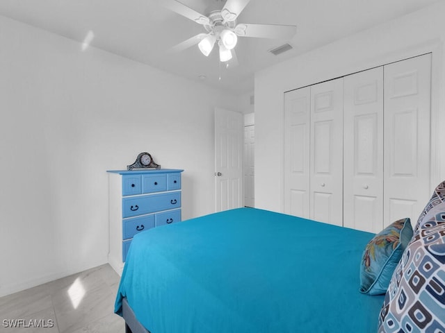 bedroom featuring a closet and ceiling fan