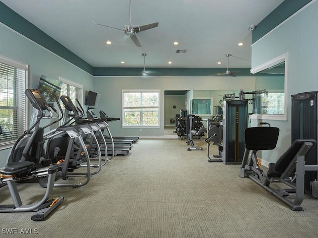 gym featuring ceiling fan and light colored carpet