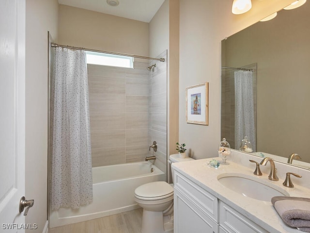 full bathroom with vanity, toilet, and shower / bath combo with shower curtain