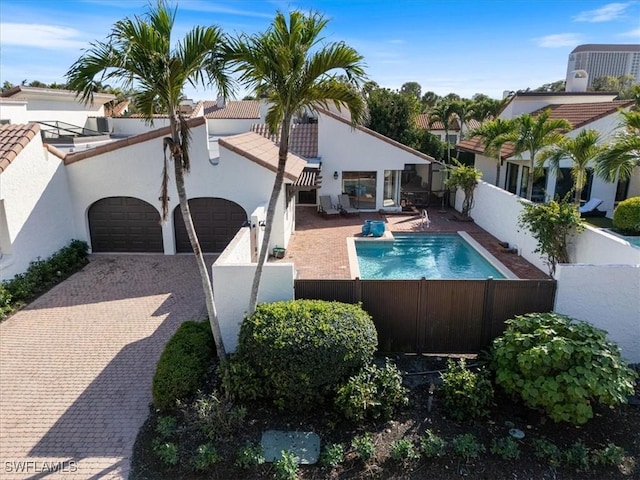 view of pool featuring central AC unit and a patio