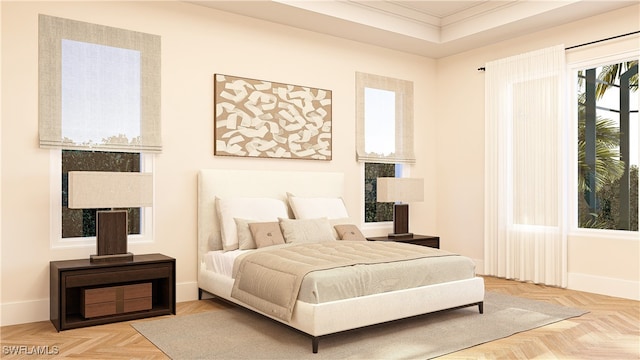 bedroom with ornamental molding, parquet floors, and a raised ceiling