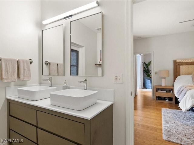 bathroom with vanity and hardwood / wood-style flooring